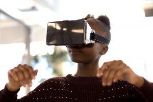 Young girl using virtual reality glasses