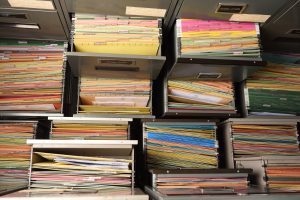 Important documents arranged in a file placed in a filing cabinet.